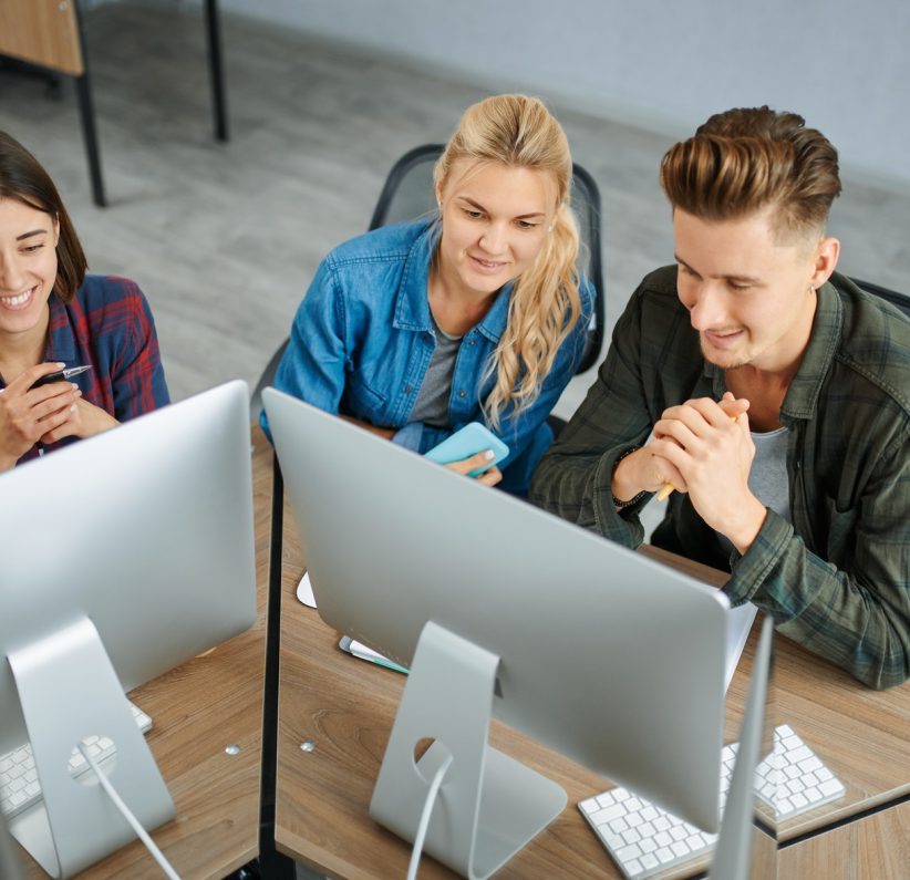 smiling-it-specialists-works-on-computers-office.jpg